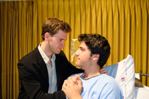 Roger (Tyson Coady) and Gordon (Andrew Cohen) share a hospital bedside moment 